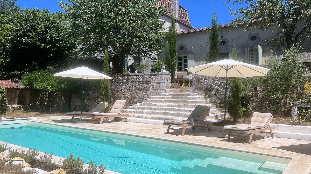 The sunny pool terrace and stone steps leading to Maison Rivers